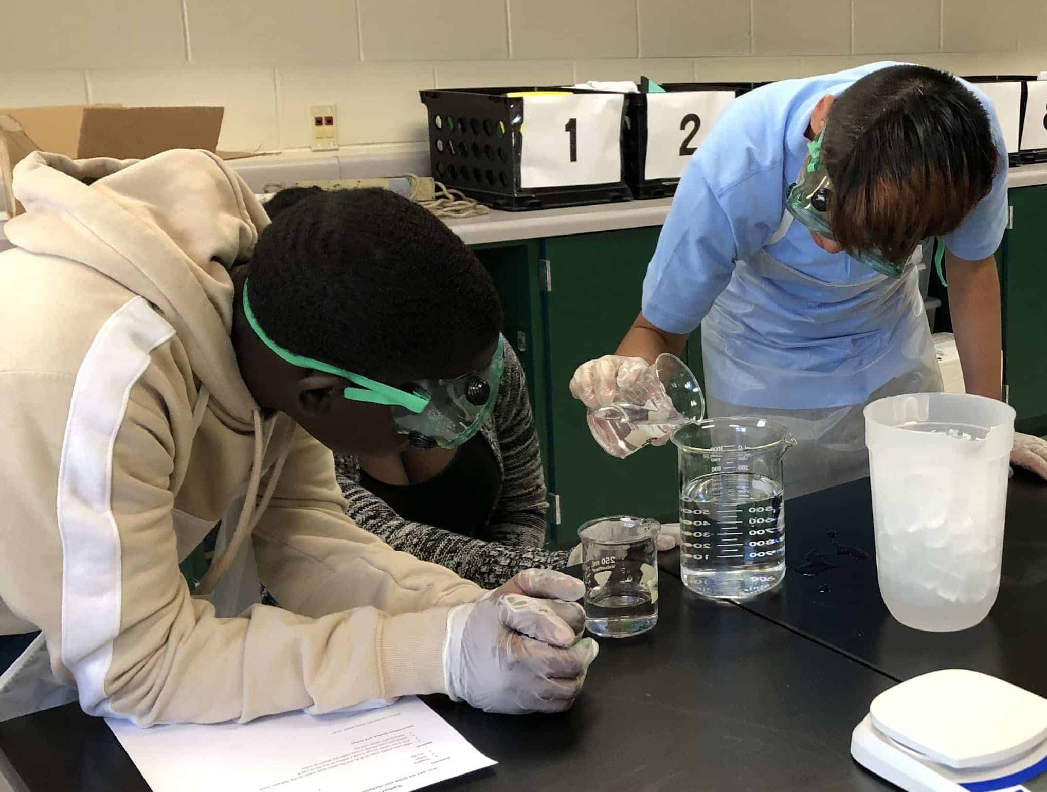 two students conducting a science experiment in Richmond Virginia.