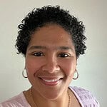 Professional woman smiling, representing business consulting services at CTLG.