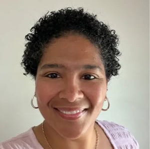 Professional woman smiling, representing business consulting services at CTLG.