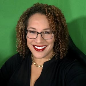 Professional woman smiling, business profile photo, CTLG consulting firm branding.