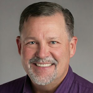 Expert business consultant smiling in professional headshot at CTLG Consulting.
