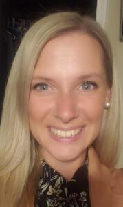 Confident woman smiling, representing business consulting services.