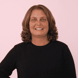 Professional woman smiling, representing business consulting services.