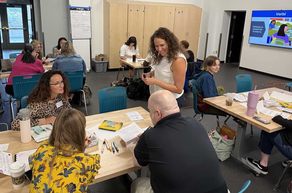 Empowering English learners through collaborative discussions in a professional development workshop.