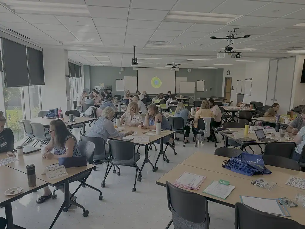 K-12 Math Workshop Classroom Scene Students engaged in math activities during a K-12 workshop session.